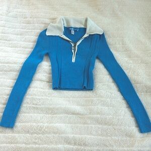 Blue corduroy fitted top that zips up from urban outfitters with collar.